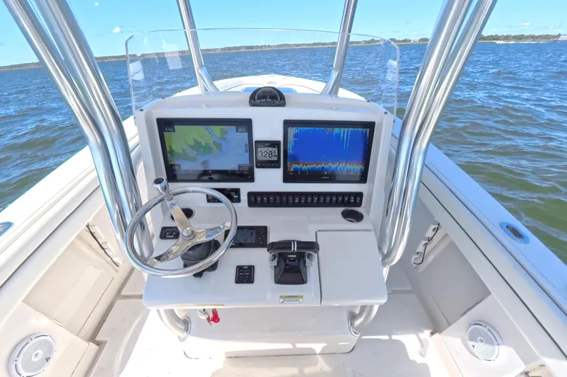  Yacht Photos Pics 2014 Jupiter 30 FS boat console with navigation screens on open water.