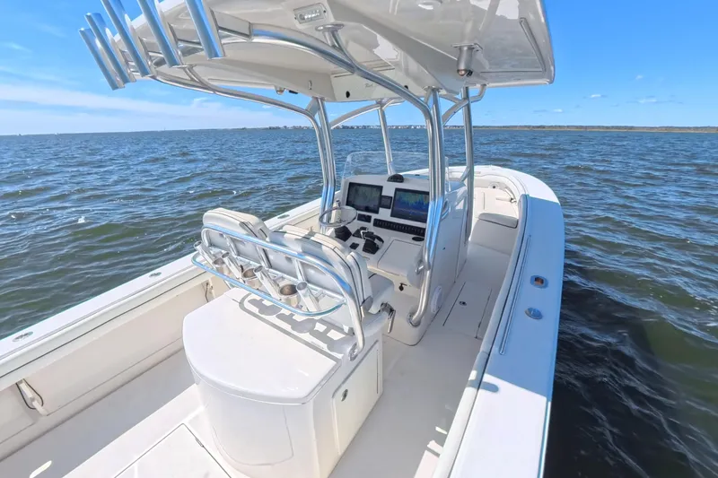  Yacht Photos Pics 2014 Jupiter 30 FS boat on open water, featuring modern helm and seating.