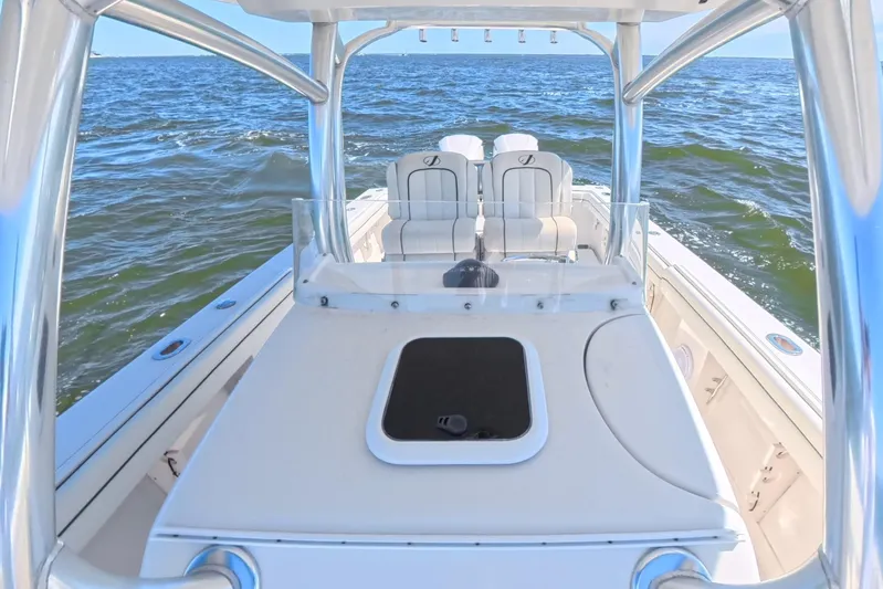  Yacht Photos Pics 2014 Jupiter 30 FS boat on open water, featuring sleek design and comfortable seating.