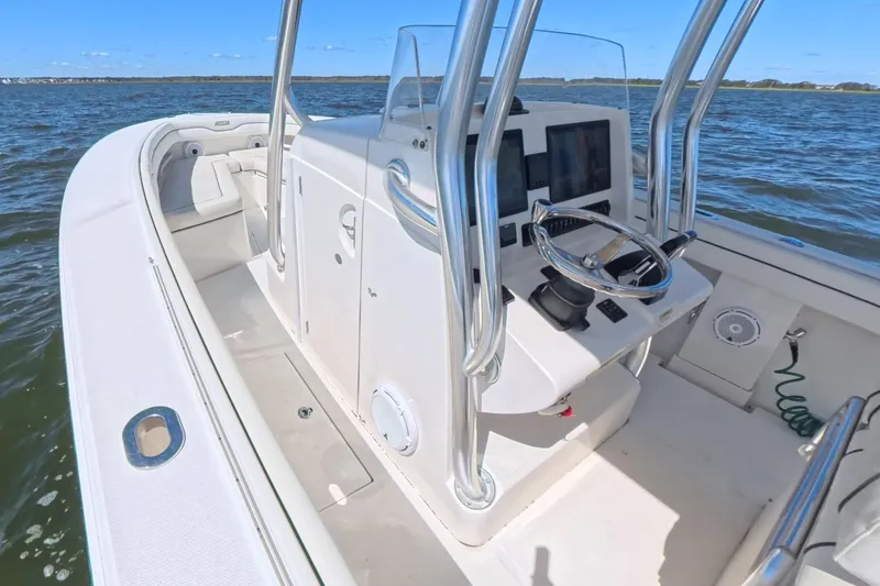  Yacht Photos Pics 2014 Jupiter 30 FS boat interior with steering console on open water.