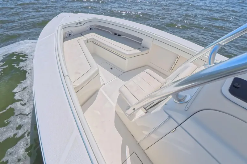  Yacht Photos Pics 2014 Jupiter 30 FS boat interior with cushioned seating on open water.