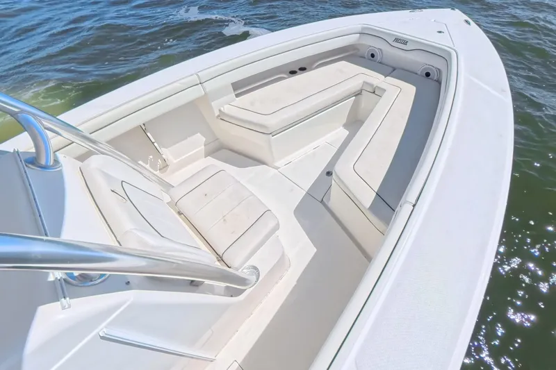  Yacht Photos Pics 2014 Jupiter 30 FS boat interior with white seating on calm water.