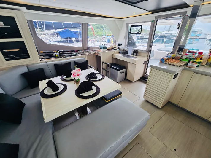 Cynthia Mae Yacht Photos Pics Luxurious interior of a 2018 Leopard 45 yacht with elegant dining area and modern amenities.