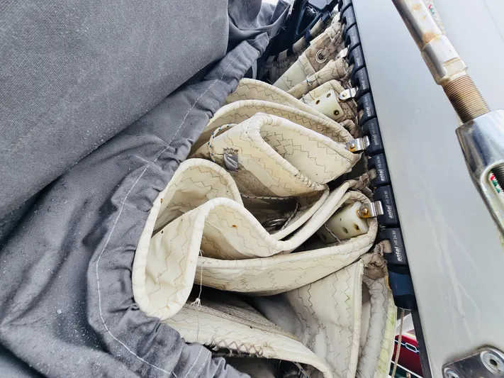 Cynthia Mae Yacht Photos Pics Folded sails on a 2018 Leopard 45 catamaran, neatly stored and secured.