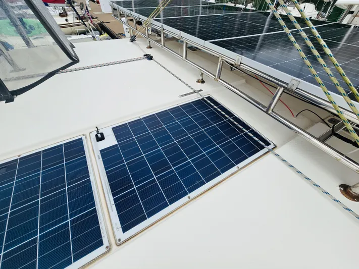 Cynthia Mae Yacht Photos Pics Solar panels on a 2018 Leopard 45 catamaran deck, harnessing renewable energy.