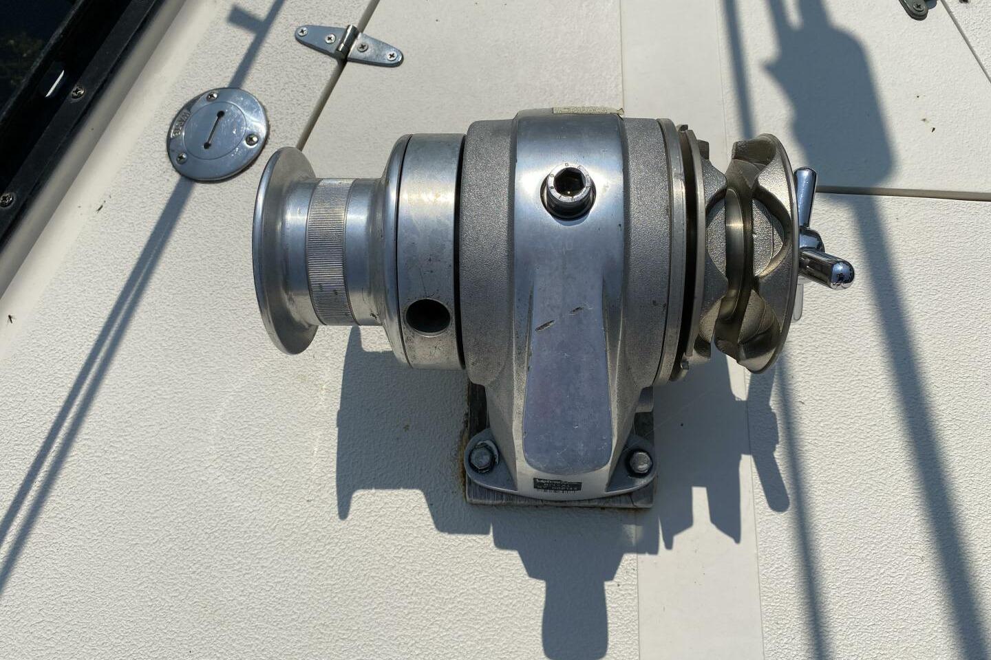 Close-up of a winch on a 1984 Aloha 34 sailboat deck.
