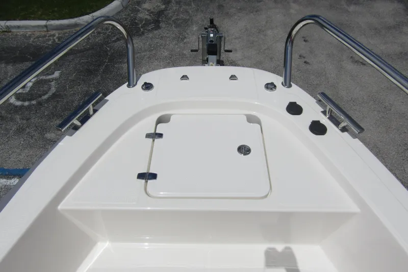  Yacht Photos Pics 2024 Nimbus T8 boat deck with storage compartment and stainless steel railings.