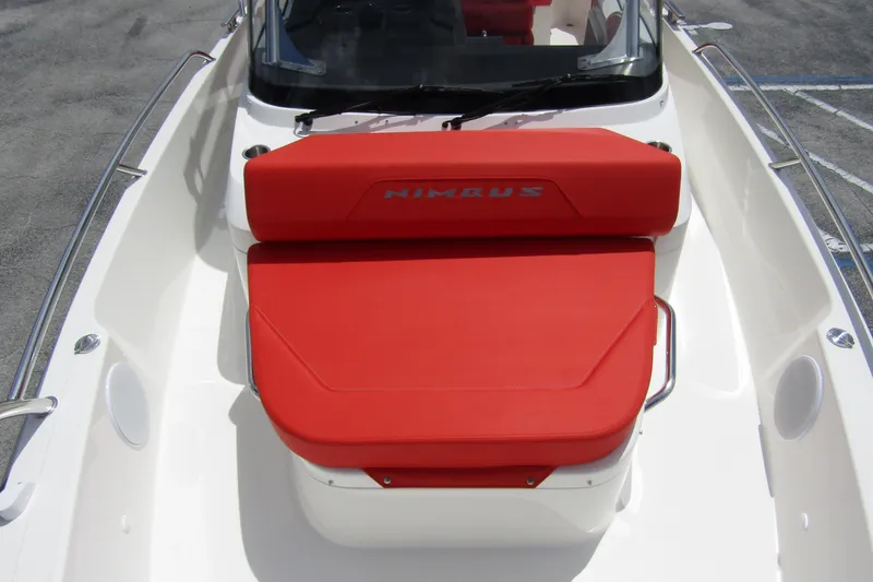  Yacht Photos Pics 2024 Nimbus T8 boat with red seating and sleek design.