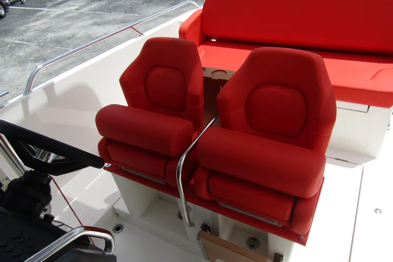  Yacht Photos Pics Red cushioned seats on 2024 Nimbus T8 boat, featuring sleek design and modern comfort.
