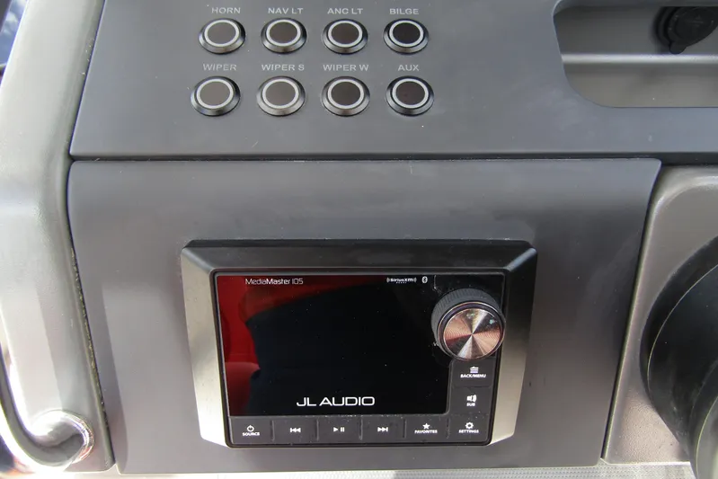  Yacht Photos Pics Control panel of 2024 Nimbus T8 with JL Audio MediaMaster display and various function buttons.