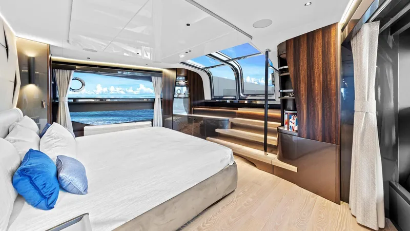 Contessa Yacht Photos Pics Luxurious bedroom interior of 2024 Sunseeker 100' Yacht with ocean view and modern design.