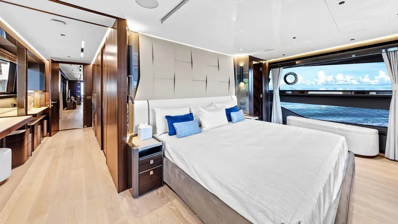 Contessa Yacht Photos Pics Luxurious bedroom interior of 2024 Sunseeker 100' Yacht with ocean view.