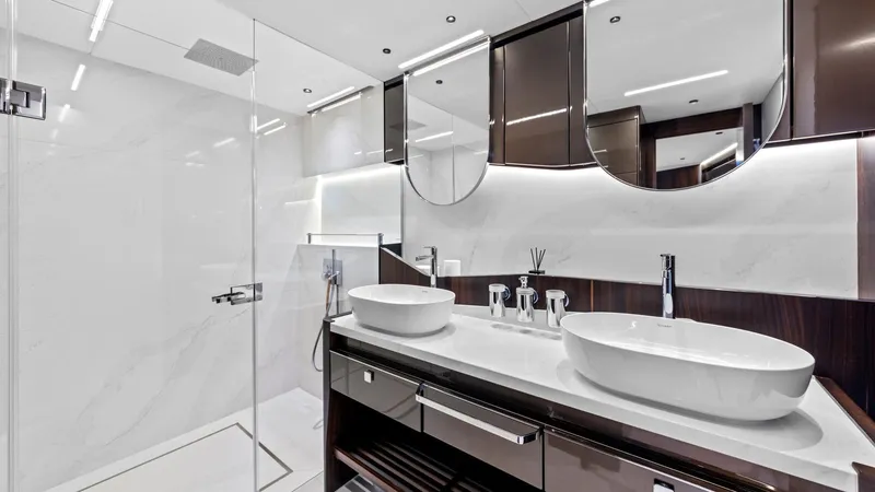 Contessa Yacht Photos Pics Luxurious bathroom in 2024 Sunseeker 100' Yacht with modern fixtures and elegant design.