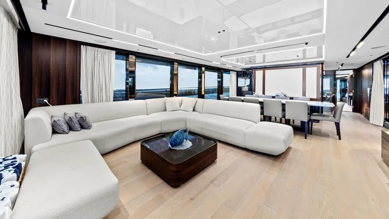 Contessa Yacht Photos Pics Luxurious interior of 2024 Sunseeker 100' Yacht with modern seating and dining area.