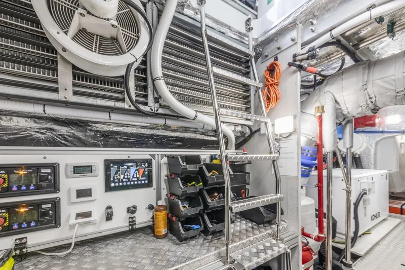 Contessa Yacht Photos Pics Engine room of 2024 Sunseeker 100' Yacht with control panels and equipment.