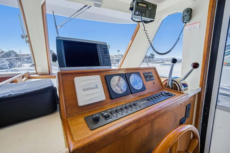  Yacht Photos Pics 1998 Mainship 350 Trawler helm with Garmin navigation and control panel.