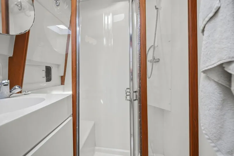  Yacht Photos Pics Bathroom interior of 1998 Mainship 350 Trawler with shower and sink.