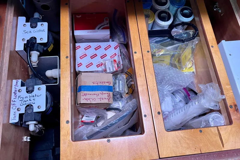 Still Got It Yacht Photos Pics Storage compartments with water pump and supplies on a 2002 Lagoon 380 catamaran.