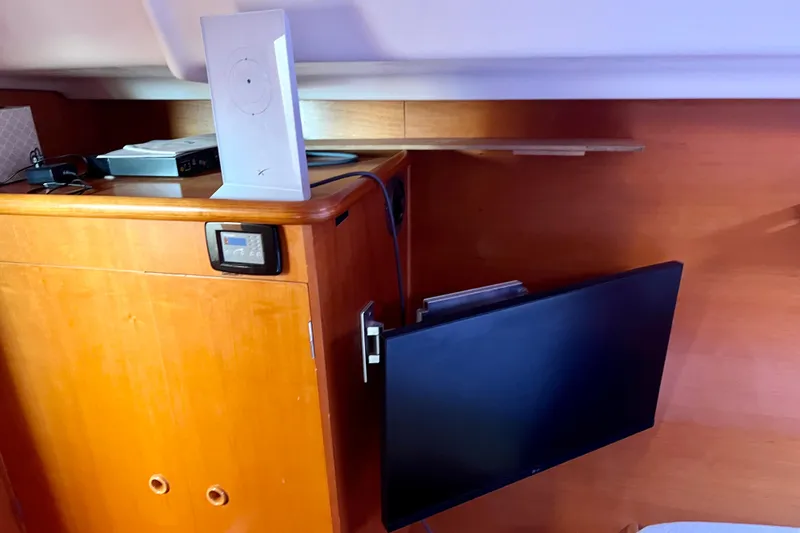 Still Got It Yacht Photos Pics Interior of 2002 Lagoon 380 yacht with mounted TV and electronic devices.