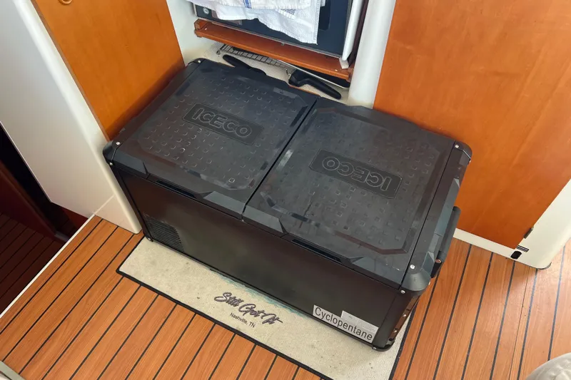 Still Got It Yacht Photos Pics Portable ICECO cooler on Lagoon 380 yacht, 2002 model, with wooden flooring.