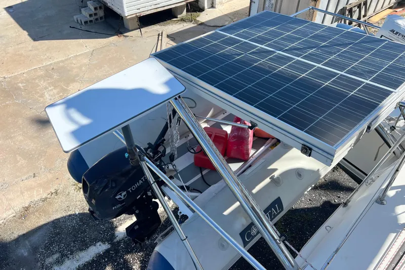 Still Got It Yacht Photos Pics Lagoon 380 catamaran with solar panels and Tohatsu outboard motor, 2002 model.