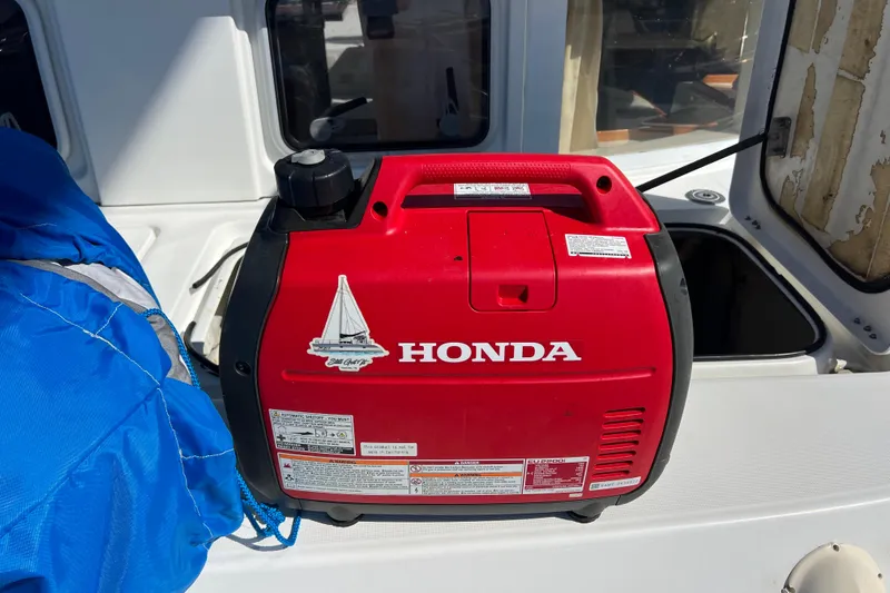 Still Got It Yacht Photos Pics Red Honda generator on a 2002 Lagoon 380 catamaran deck.