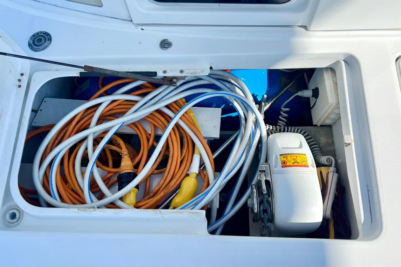 Still Got It Yacht Photos Pics Storage compartment on a 2002 Lagoon 380 boat with cables and equipment.