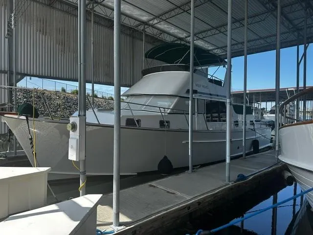 Westwind Yacht Photos Pics 2004 Westcoast 46 yacht docked in a covered marina.