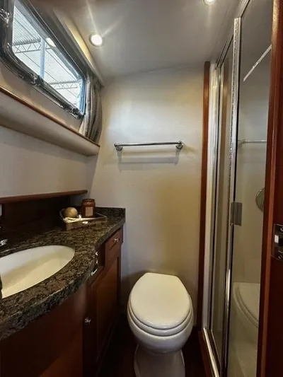 Westwind Yacht Photos Pics Luxurious bathroom in 2004 Westcoast 46 yacht with granite countertop and shower.