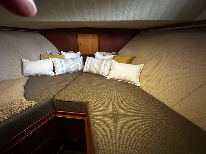 Westwind Yacht Photos Pics Cozy cabin interior of 2004 Westcoast 46 yacht with cushions and wooden accents.