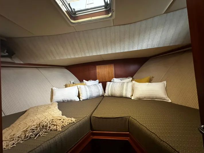Westwind Yacht Photos Pics Cozy cabin interior of 2004 Westcoast 46 yacht with plush bedding and skylight.