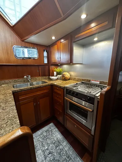 Westwind Yacht Photos Pics Luxurious 2004 Westcoast 46 yacht kitchen with granite countertops and modern appliances.