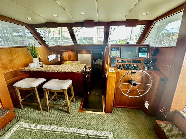 Westwind Yacht Photos Pics Luxurious 2004 Westcoast 46 yacht interior with helm, seating, and navigation equipment.