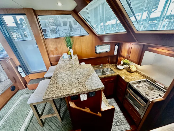 Westwind Yacht Photos Pics Luxurious 2004 Westcoast 46 yacht interior with modern kitchen and granite countertops.