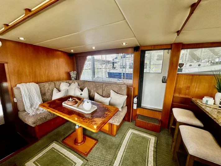 Westwind Yacht Photos Pics Luxurious 2004 Westcoast 46 yacht interior with cozy seating and elegant wooden table.