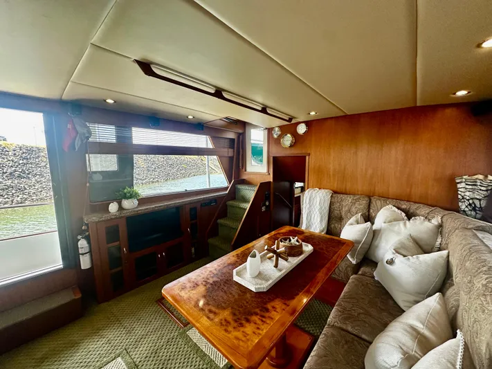 Westwind Yacht Photos Pics Luxurious interior of 2004 Westcoast 46 yacht with elegant wood finishes and comfortable seating.