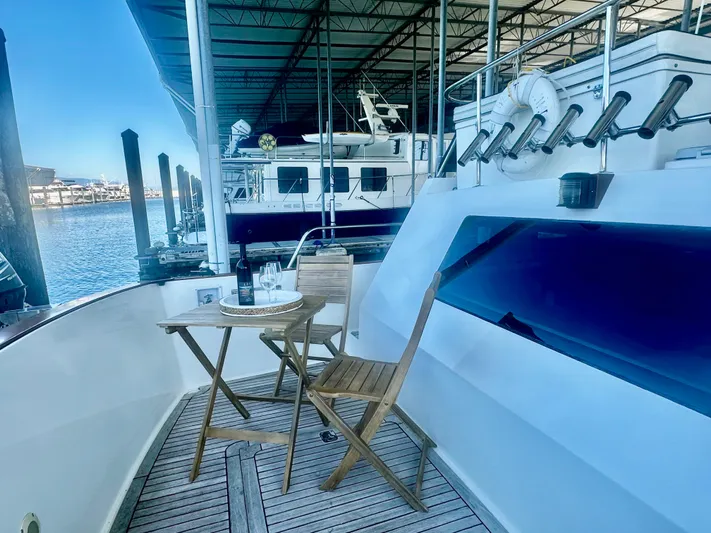 Westwind Yacht Photos Pics Outdoor seating on 2004 Westcoast 46 yacht deck, with marina view.