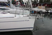 Dufour 40 Performance 2007 sailboat docked in marina, surrounded by other boats.