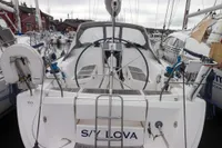 2007 Dufour 40 Performance sailboat docked in a marina, rear view.