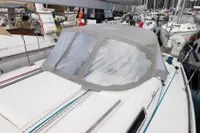 Dufour 40 Performance 2007 sailboat with cockpit cover, docked in a marina.