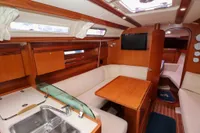 Interior of 2007 Dufour 40 Performance yacht with cozy seating and modern amenities.