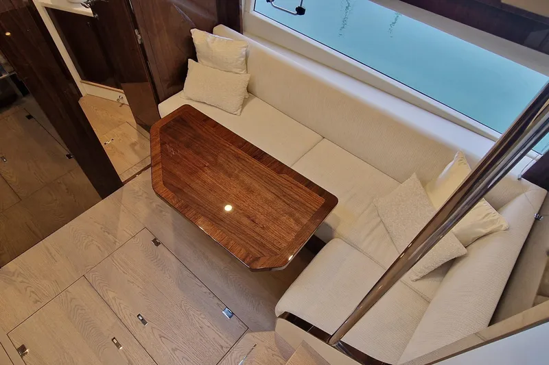 Volvo Ips & Dps Yacht Photos Pics Luxurious interior of 2024 Fairline Targa 45 Open yacht with elegant seating and wooden table.