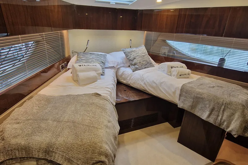 Volvo Ips & Dps Yacht Photos Pics Luxurious 2024 Fairline Targa 45 Open cabin with twin beds and elegant decor.