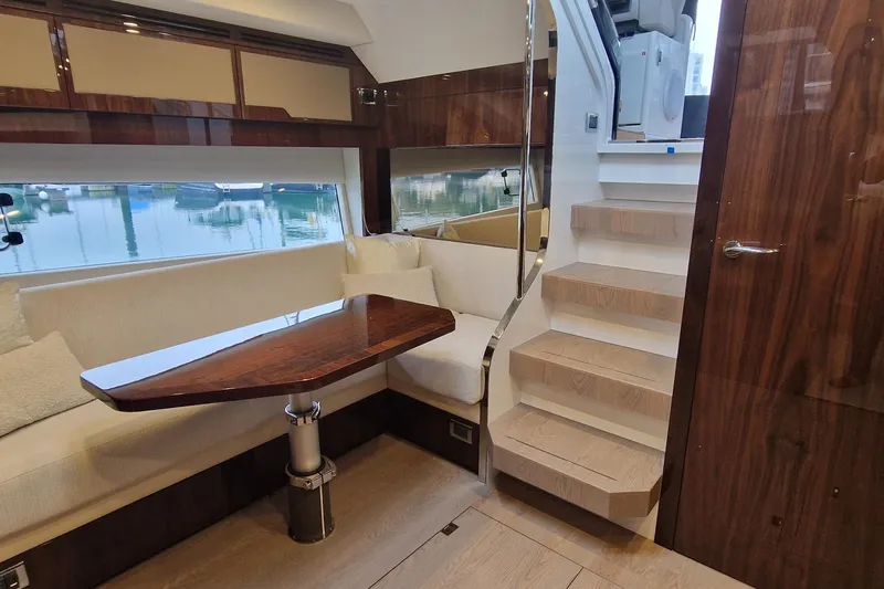 Volvo Ips & Dps Yacht Photos Pics Luxurious interior of 2024 Fairline Targa 45 Open yacht with elegant seating and wooden finishes.