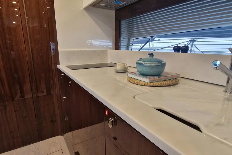 Volvo Ips & Dps Yacht Photos Pics Luxurious kitchen interior of 2024 Fairline Targa 45 Open yacht, featuring sleek countertops.