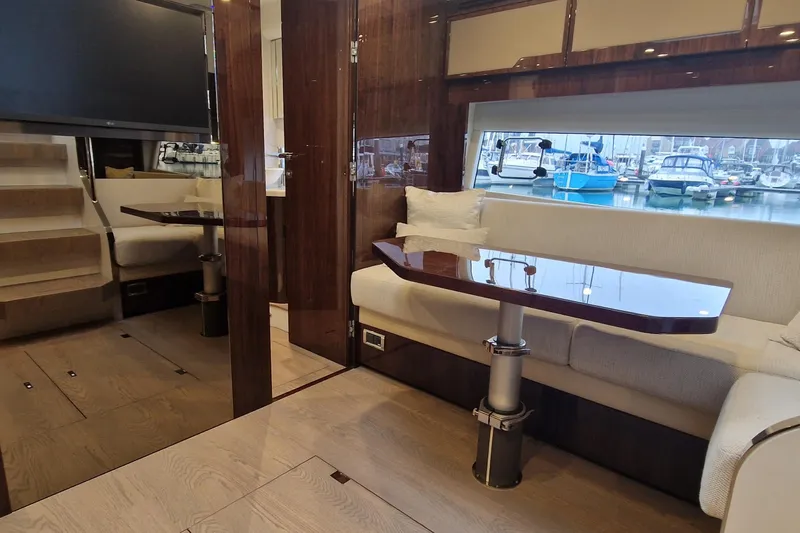 Volvo Ips & Dps Yacht Photos Pics Luxurious interior of 2024 Fairline Targa 45 Open yacht with elegant seating and marina view.