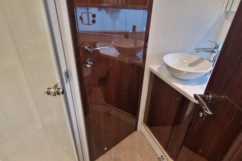 Volvo Ips & Dps Yacht Photos Pics Luxurious bathroom interior of 2024 Fairline Targa 45 Open yacht with modern fixtures.