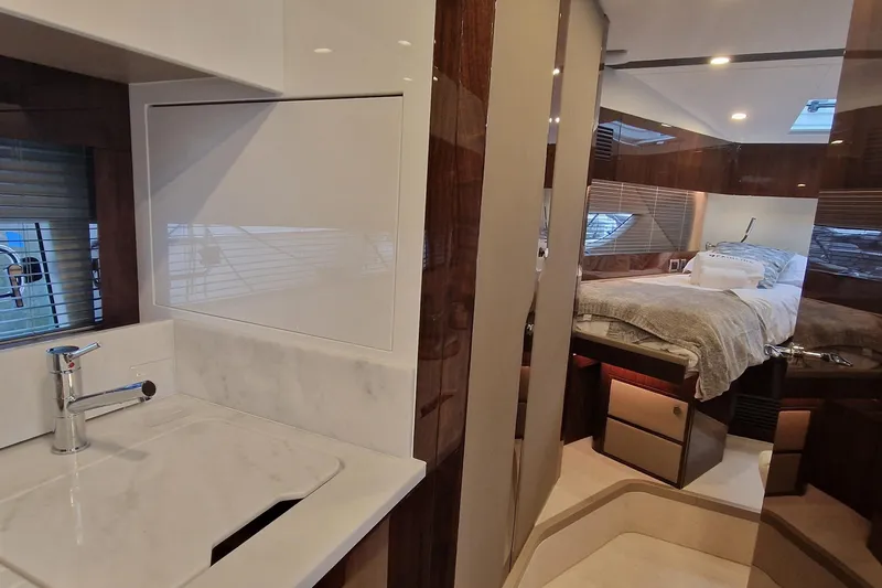 Volvo Ips & Dps Yacht Photos Pics Luxurious interior of 2024 Fairline Targa 45 Open yacht, featuring bedroom and bathroom.