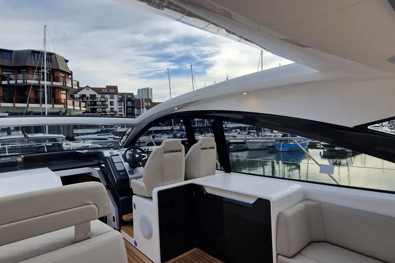 Volvo Ips & Dps Yacht Photos Pics 2024 Fairline Targa 45 Open yacht interior with modern seating and marina view.