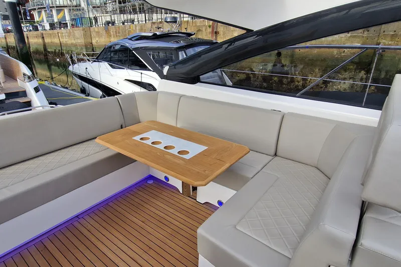 Volvo Ips & Dps Yacht Photos Pics Luxurious seating area on 2024 Fairline Targa 45 Open yacht with elegant wood table.